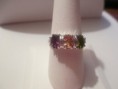 Three-stone amethyst, peridot and citrine with diamond accents set in sterling silver